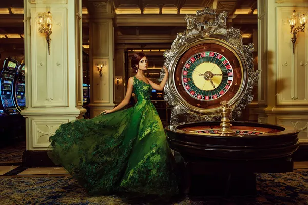 6777BET Casino Games — Enjoy nonstop entertainment A close-up shot of golden coins falling around a spinning roulette wheel, representing immersive casino action at 6777BET.